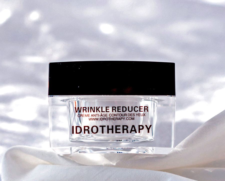 Idrotherapy Wrinkle Reducer jar on white silk